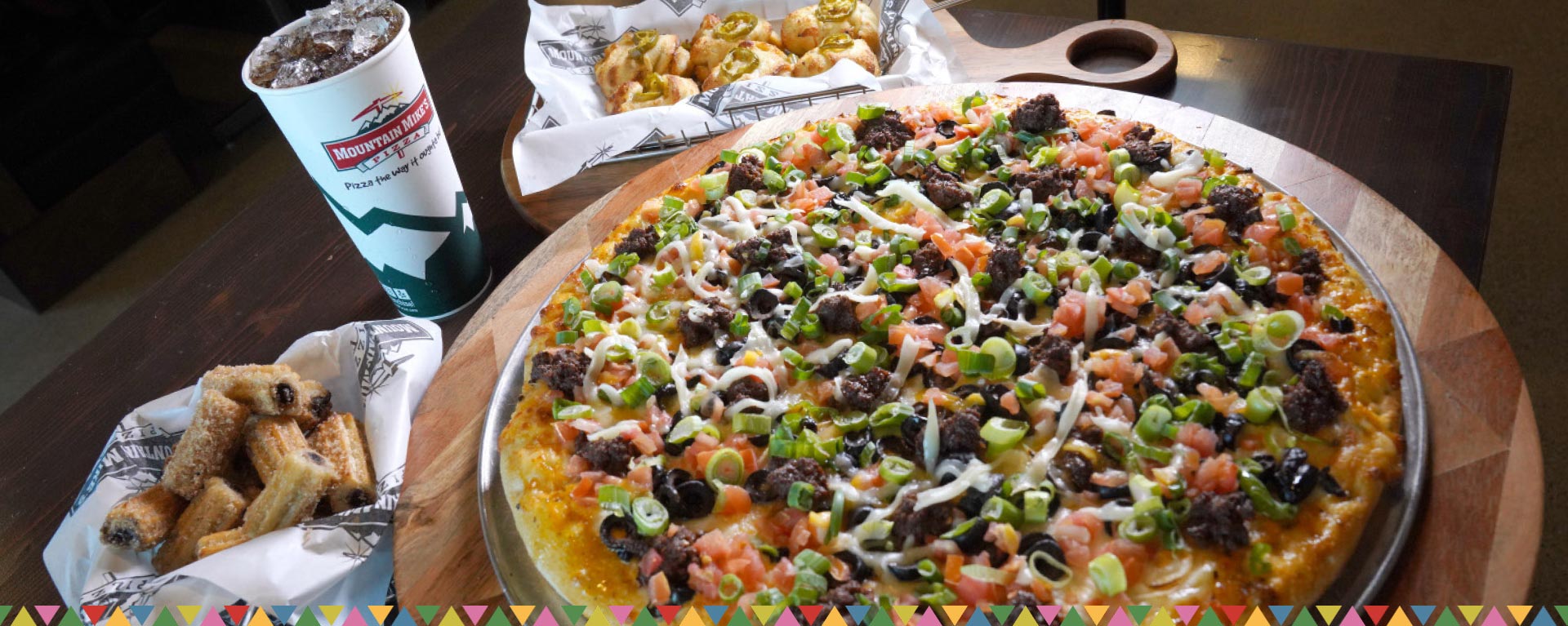 pdm-hero-mobile Fiesta Taco Pizza topped with taco-seasoned beef, veggies, and Jalapeño Cheese-Tomatillo Serrano Sauce