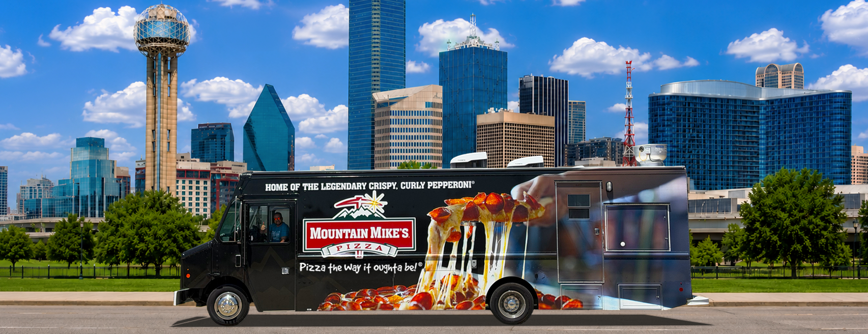food truck in front of the dallas skyline